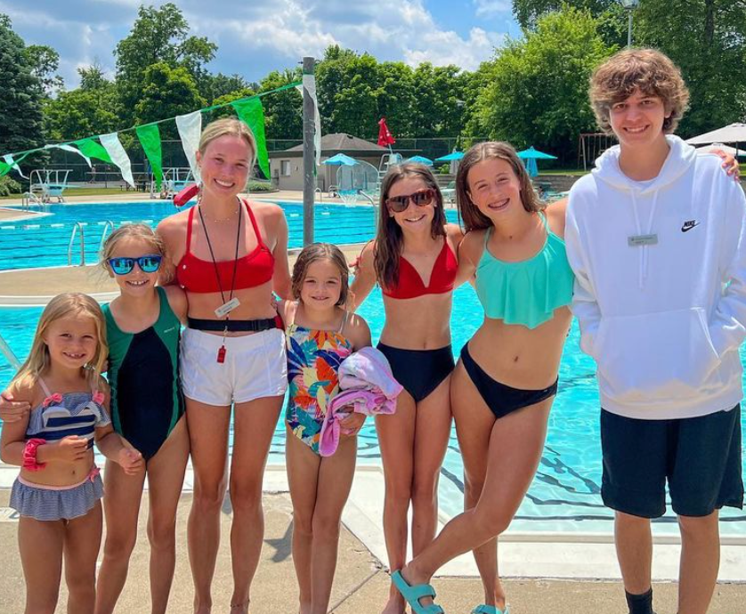 Group of kids on pool deck.